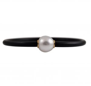 Autore South sea pearl neoprene bracelet. Featuring a 12mm semi drop white South Sea pearl. The pearl has small 18K yellow gold rondelles on  either side which is attached to a black neoprene bracelet.