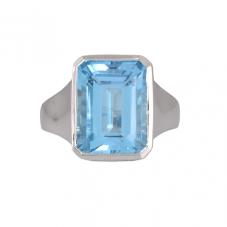 Blue topaz ring emerald cut 9.65ct in a bezel setting 9K white gold