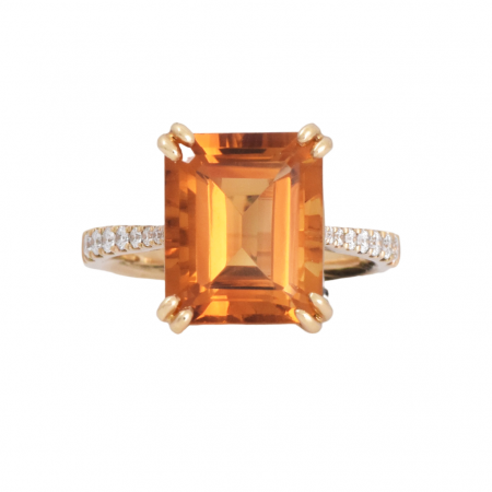 A 9K yellow gold Citrine and diamond cocktail dress ring. Featuring a 5.9ct Citrine step cut in a double claw set with diamonds going half way around the band. Gemstone Carat Citrine: 5.99ct Diamond: 16 = 0.20ct RING SIZE: M