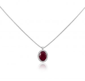 An 18K white gold faceted oval ruby and diamond halo pendant. Featuring a stunning Ruby at 1.18ct. GEMSTONE CARAT: Ruby = 1.18ct DIAMOND = 0.16ct