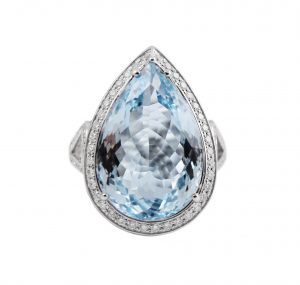 Aquamarine Pear cut diamond ring set in 18K white gold. Featuring an amazing 12.29ct pear cut Aquamarine surrounded by a claw setting of round brilliant cut diamonds totaling up to 1.12ct. Gemstone Carat Aquamarine: 12.29ct Diamond: 170 = 1.12ct