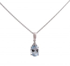 Aquamarine oval cut and three diamonds pendant set in 18K white gold. Featuring an 1.43ct oval cut Aquamarine with three round brilliant cut diamonds at the bottom of the bail.
