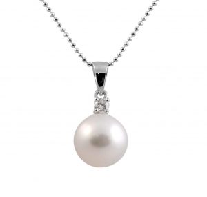 A Classic South Sea pearl pendant set in 18K White Gold featuring a round brilliant cut diamond at the bail. A simplistic design easily matched with. Chain is sold separately.. Pearl size: 1 = 10mm Carat: 1 = 0.10ct