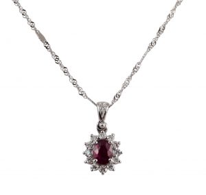oval ruby and halo diamond pendant
