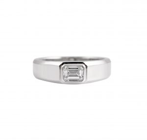 Emerald cut ring in platinum 950, featuring a 0.74ct rectangular Emerald cut diamond set into a bezel setting. CAR