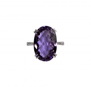 oval purple gemstone and diamond ring