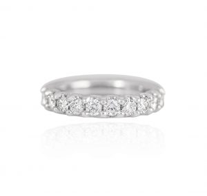 User This Scallop Set Diamond Band is set in platinum. Featuring eleven round brilliant cut diamonds in a scallop band setting.