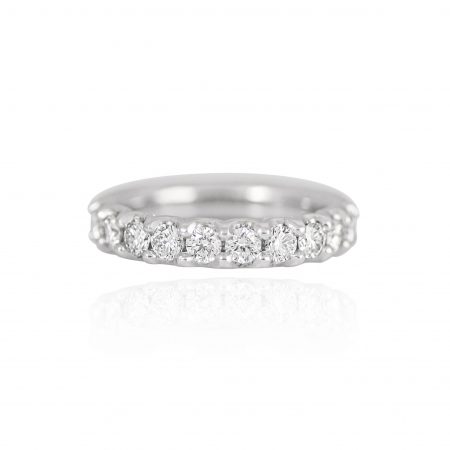 User This Scallop Set Diamond Band is set in platinum. Featuring eleven round brilliant cut diamonds in a scallop band setting.